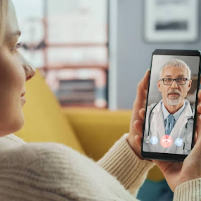 Doctor holding mobile phone and typinging